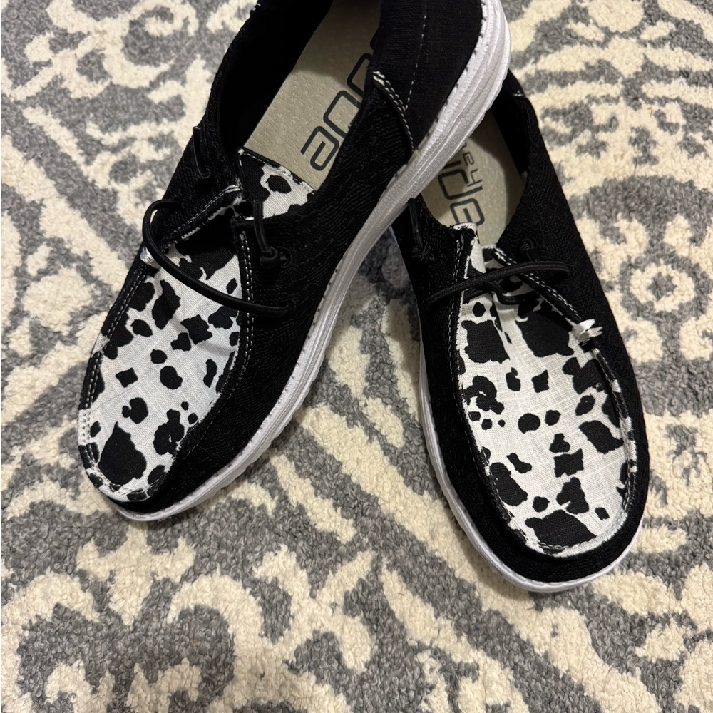 Hey Dude Black and White Sneakers with Bold Pattern